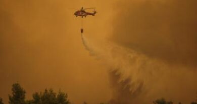 Two firefighting helicopters collide while battling wildfire in Greece